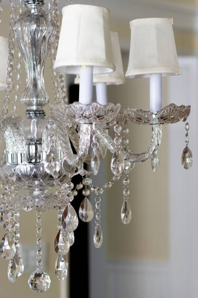 istock Classic white hanging chandelier suspended from the ceiling. 1850143176