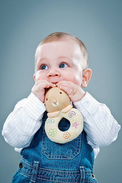 istock Cute Baby Eating a Toy 185014364