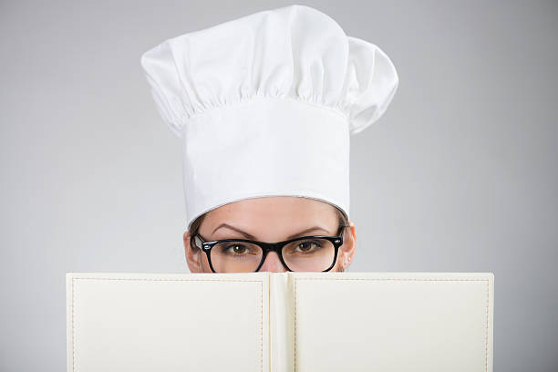 istock Woman in chef's hat looking at camera 185014576