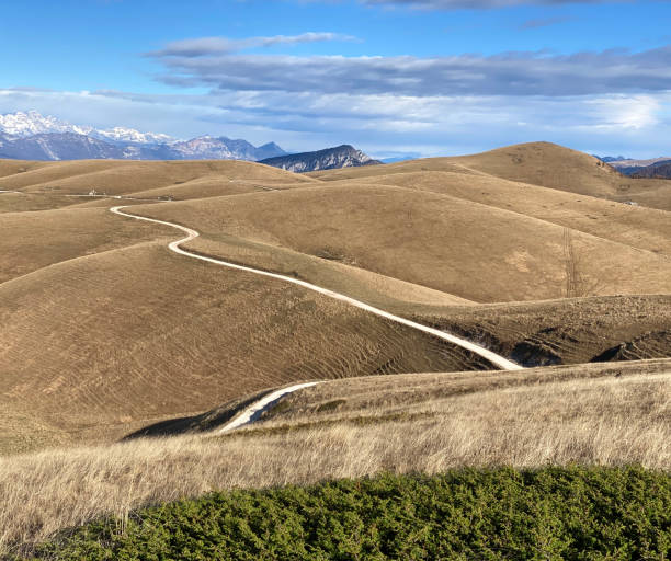 istock Mountain landscape with dirt road 1850162695