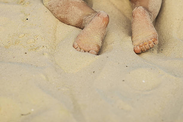 istock Baby feet on the beach 185018085