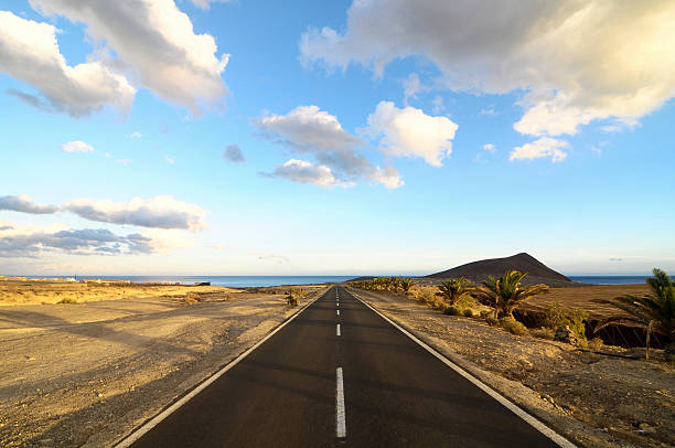 istock Lonely Road in the Desert 185018293