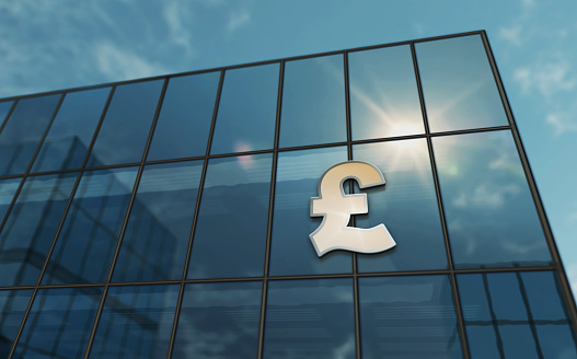 Pound Sterling UK GPB glass building concept. British money banking and GB economy symbol on front facade 3d illustration.