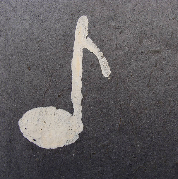 istock musical note in white paint on grunge stone wall 185018689
