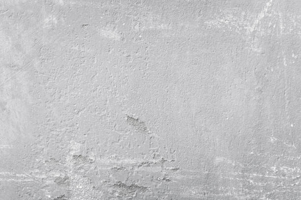 istock Old gray concrete wall. Rough grainy stone texture background 1850202945