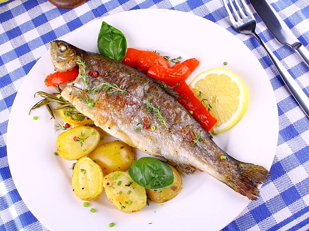 istock Grilled trout with red pepper, rosemary and potato 185022221