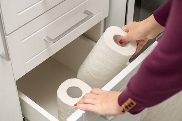 istock woman taking out paper towel from kitchen drawer 1850244337