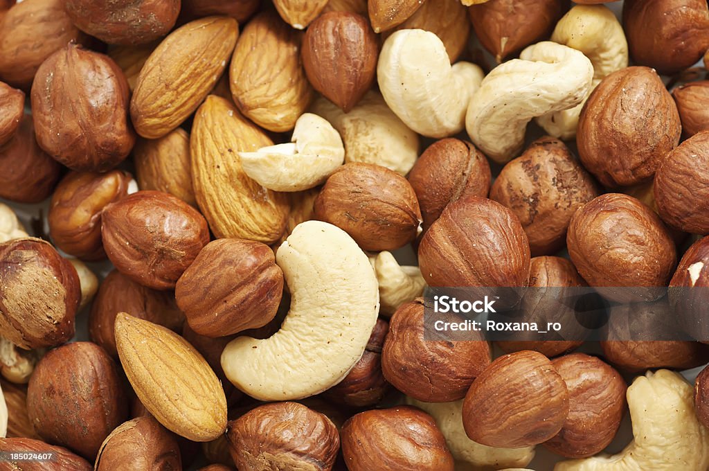 Nuts background Background from various kinds of nuts (almond, hazelnut, cashew, Brazil nut) Backgrounds Stock Photo