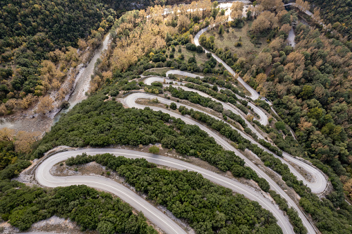 Papingo hairpin curvy road in Vikos National Park, Epirus, Greece. Dangerous roads