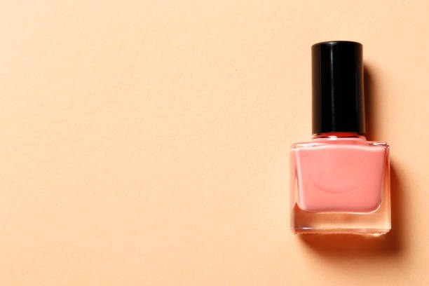 istock Nail polish on pink background 1850253591