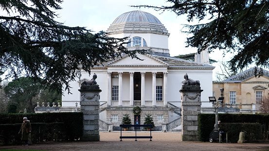 London, UK - 11.12.2023. Fragment of facade of Chiswick House and gardens - 18th century mansion in West London. Free access to the garden. Baroque style villa in Chiswick, London.