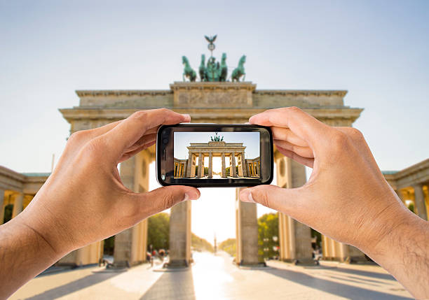 istock photographing with the phone a brandenburg gate 185026547