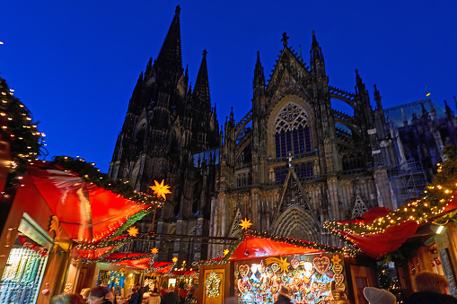 Cologne, Germany - December 12, 2023: Crowd at the Christmas market in front of the cathedral in Cologne.