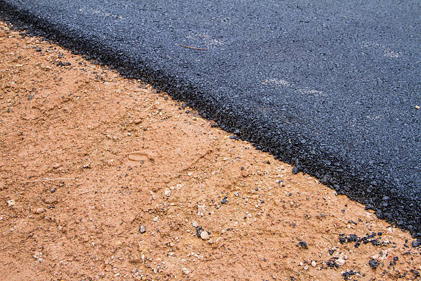 istock New asphalt. Reconstruction of road 185028197