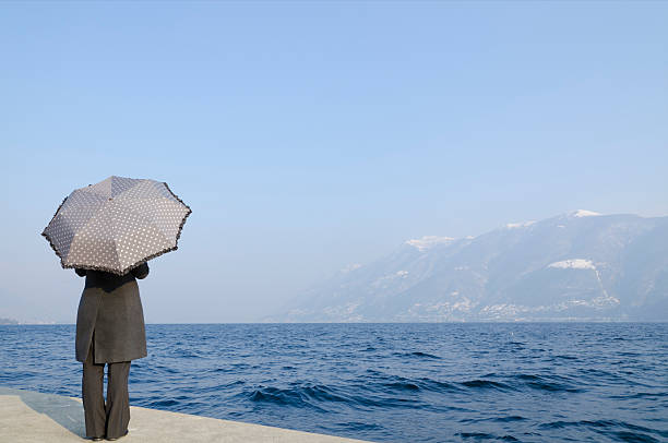 istock Woman with an umbrella 185028494