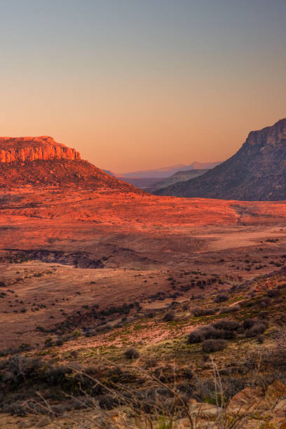istock Hills in the Lesotho mountains glow red at sunset 1850289105