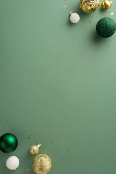 istock Modern Yuletide sophistication. Top view vertical image showcasing opulent baubles, and golden sequins on pastel green background, with an empty space for greetings or promotional messages 1850291647