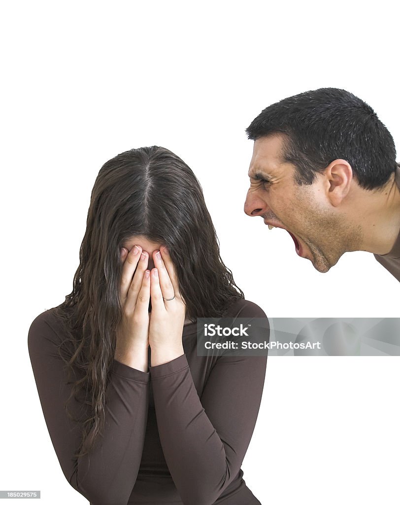 Woman with hands on face next to man yelling Domestic violence Abuse Stock Photo