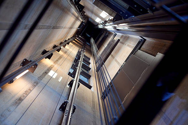 Inside an Elevator Shaft Inside a modern lift shaft. steel cable photos stock pictures, royalty-free photos & images