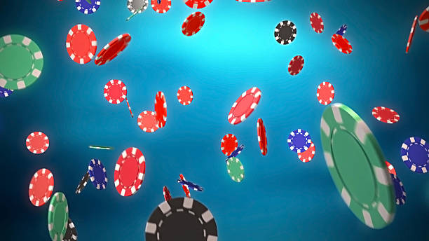 istock Casino color chips dropping with blue background 185032421