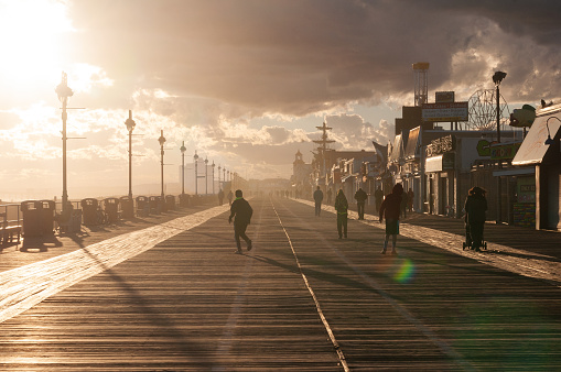 Ocean City, NJ, USA - The boardwalk in Ocean City, New Jersey, during sunset.