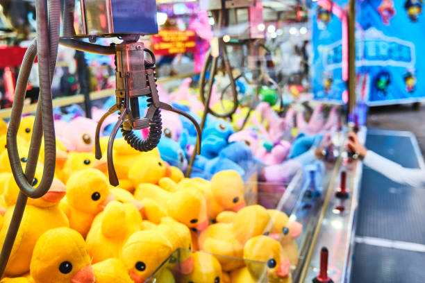 istock Fairground attraction catching stuffed toys 1850345277
