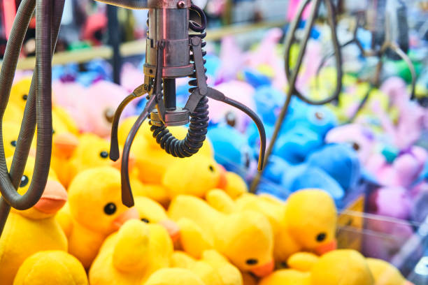 istock Fairground attraction catching stuffed toys 1850345303