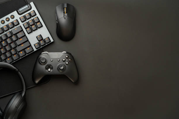 istock Gaming concept on black background with computer keyboard and joystick 1850346879