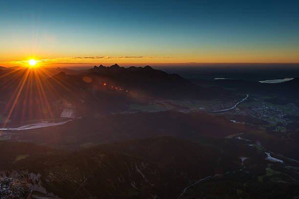 istock sunbeams at sunset in austrian alps 185035408
