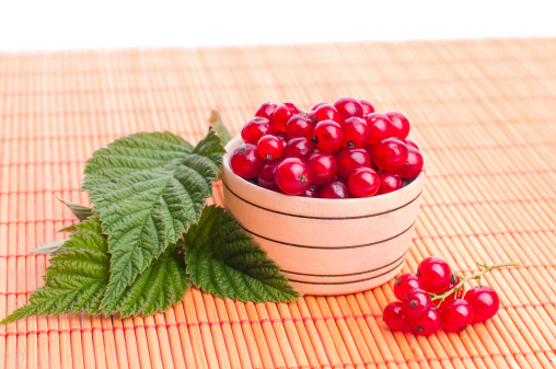 Red Currant close up, currant in a wood bowl