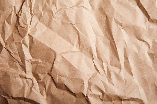 ridée papier kraft - brown paper paper crushed wrinkled photos et images de collection