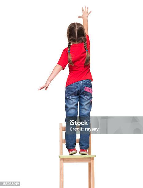 Little Girl Wearing Red Tshirt And Reaching Out Something Stock Photo - Download Image Now