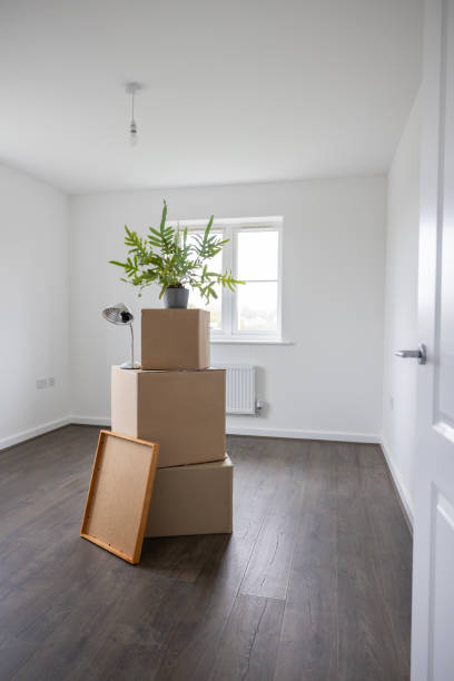 istock Empty Room In New Home On Moving Day With Packing Boxes 1850383851