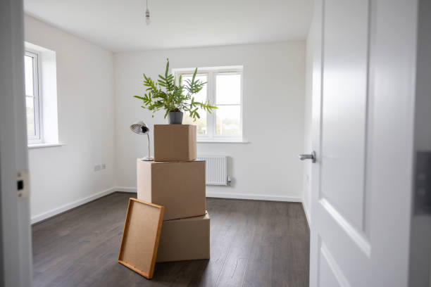 istock Empty Room In New Home On Moving Day With Packing Boxes 1850384472