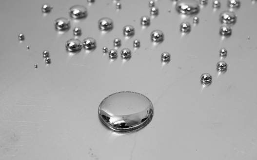 mercury toxic metal, spilled drops of mercury