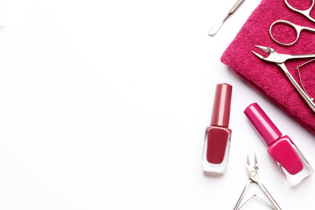 istock Composition of tools for manicure, nail polishes, towels on a white background with space for text. 1850400860