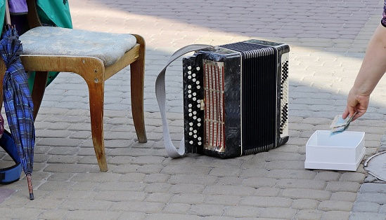 Workplace of a street musician-accordion player.