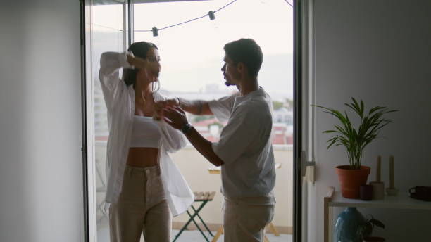 istock Cute spouses bonding home closeup. Affectionate boyfriend spinning wife dancing 1850414678