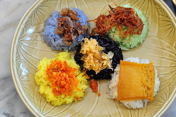 5 color sticky rice served with difference tops, famous Thai stock photo