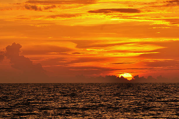 beautiful sunset at the beach , thailand stock photo