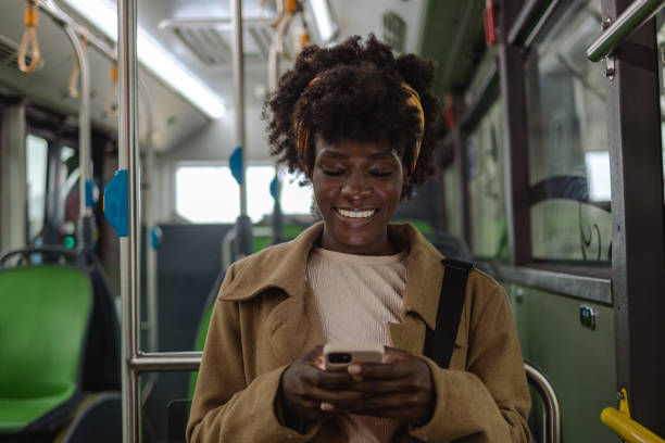 istock Female commuter using smart phone in bus 1850426269