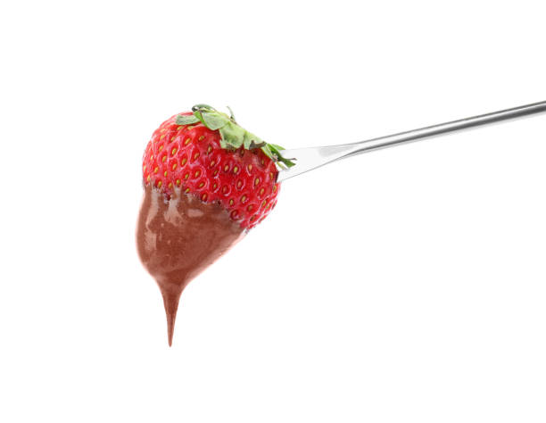 istock Strawberry with melted chocolate on fondue fork against white background 1850434147