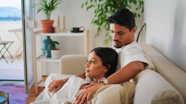 istock Married people resting sofa closeup. Romantic newlyweds relaxing together 1850434693
