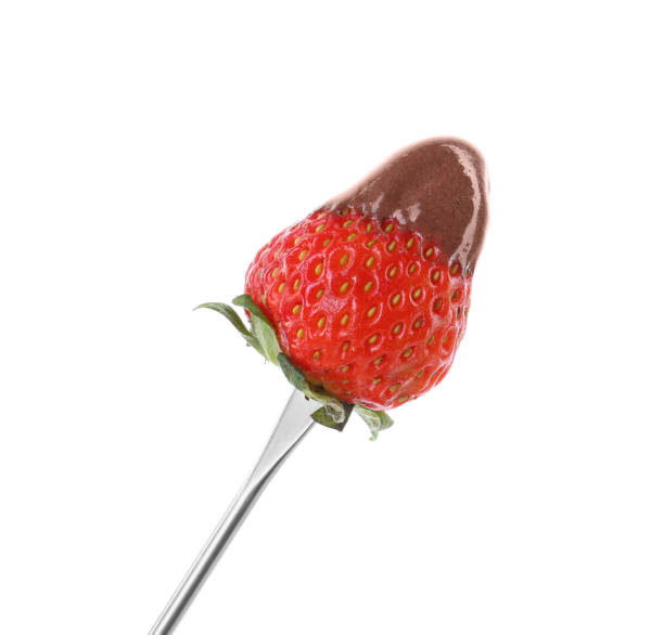 istock Strawberry with melted chocolate on fondue fork against white background 1850437299