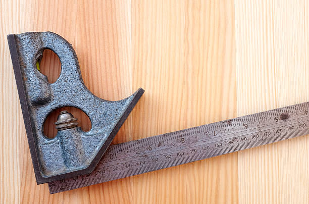 istock Closeup of metal set square on wood 185045809