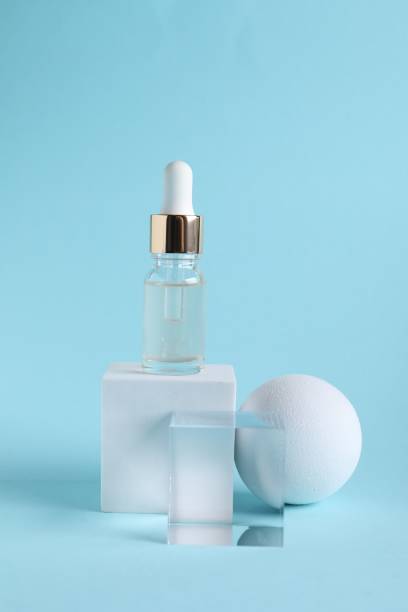 istock Stylish presentation of cosmetic serum on light blue background 1850481089