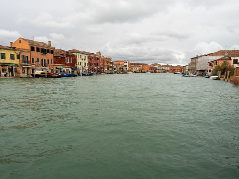 Murano, Italy - November 3 2023: Canal Grande di Murano seen from the Ponte Longo. Murano is a series of islands linked by bridges in the Venetian Lagoon.