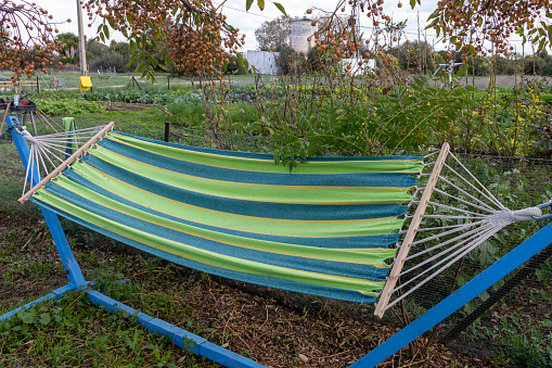 Traditional hammock in a wild garden