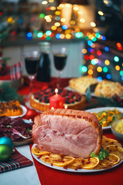 istock Christmas Dinner with Baked Glazed Ham and Various Vegetables 1850523740