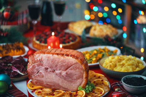 istock Christmas Dinner with Baked Glazed Ham and Various Vegetables 1850524260